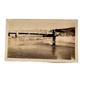 1940s B&W Photo Man Ice Skating Frozen Lake Pond Bridge in Background Snapshot